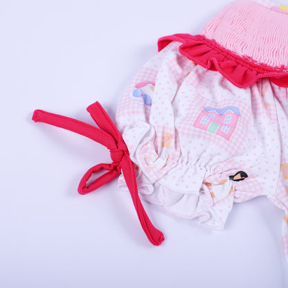 Side view showing the adjustable hot pink sleeve bow and ruffle trim on Dolly & Me vintage toys bubble romper.