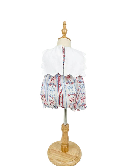 Back view of Patriotic Grandmillennial embroidered baby bubble on dress form displaying wide scalloped collar details.