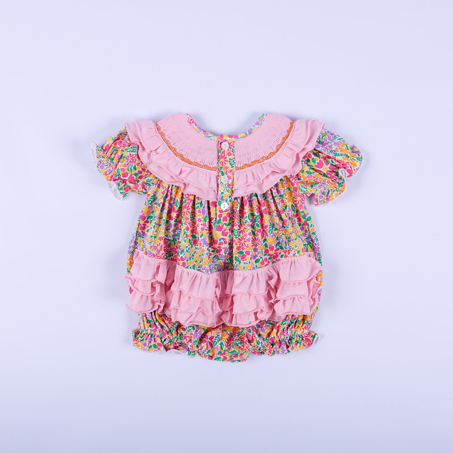 Full back view of the pink floral Thanksgiving baby bubble romper, showcasing the button closure and cute back ruffles.