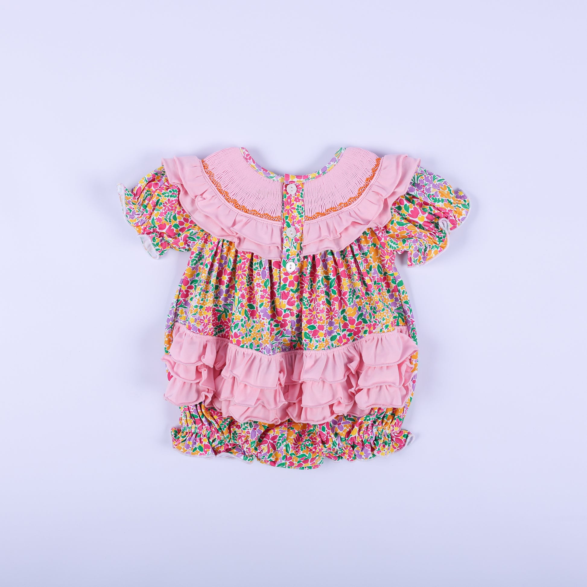 Full back view of the pink floral Thanksgiving baby bubble romper, showcasing the button closure and cute back ruffles.