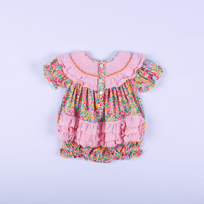 Full back view of the pink floral Thanksgiving baby bubble romper, showcasing the button closure and cute back ruffles.