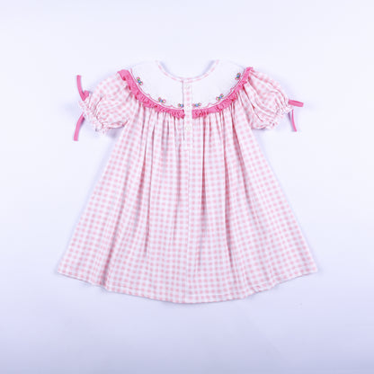Full back view of pink gingham Big Sister hand-smocked dress showing back button closure and puff tie sleeves.