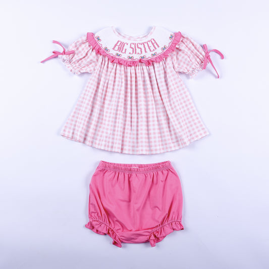 Pink gingham hand smocked Big Sister dress top with matching pink bloomer diaper cover set for toddler girls.