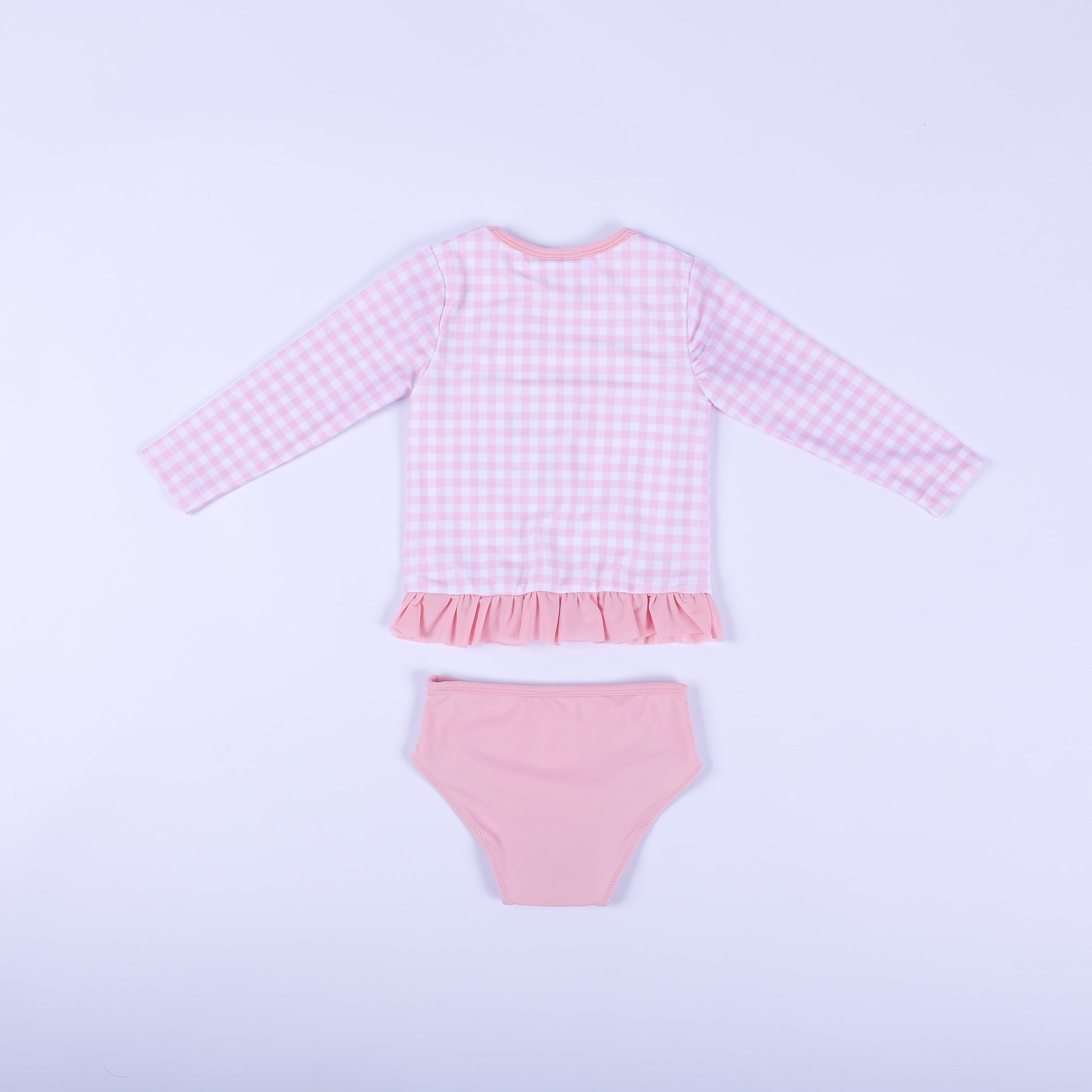 Back flat lay view of the pink gingham fairytale princess two piece swimsuit showing the solid pink bikini bottoms.