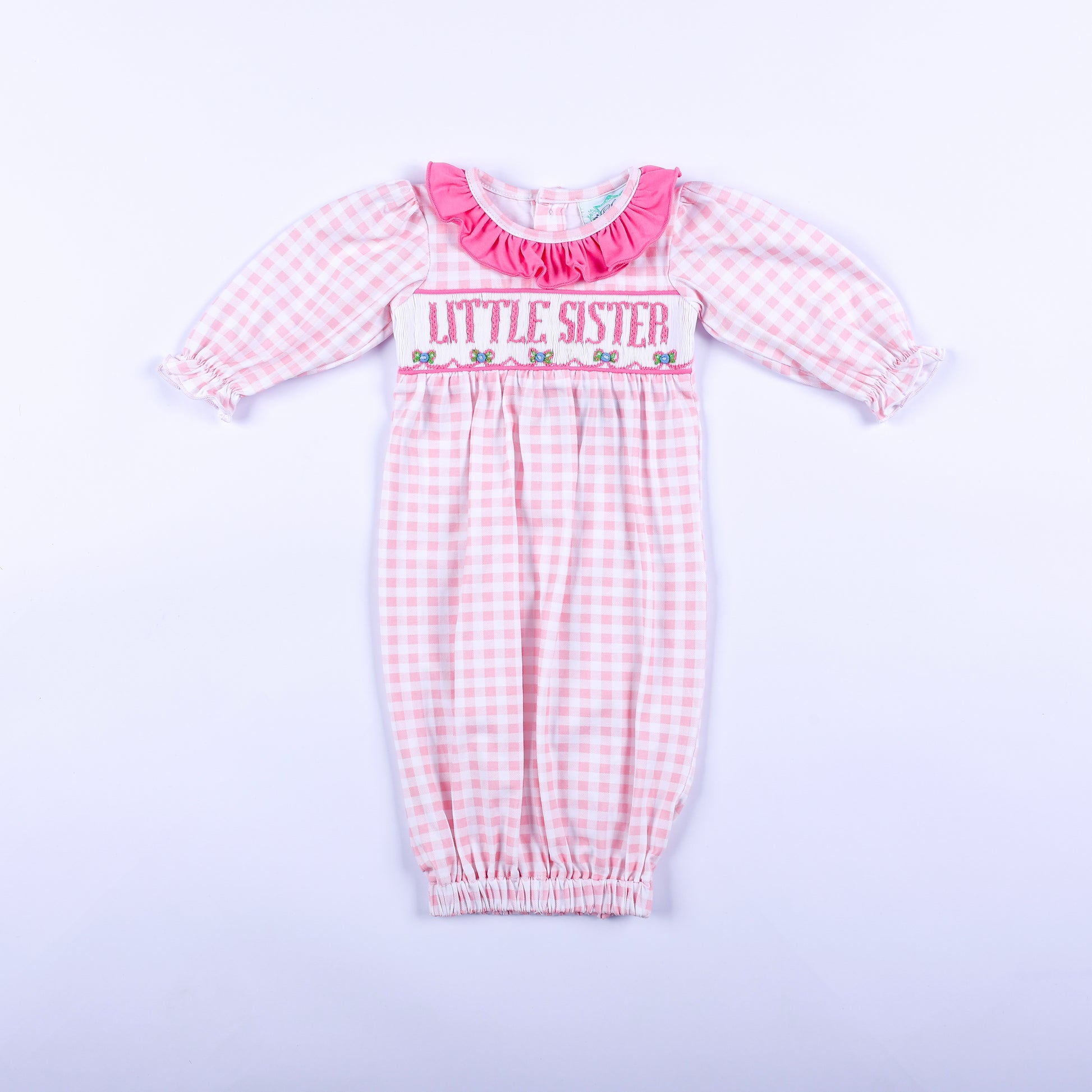 Pink gingham hand smocked Little Sister layette sleep sack featuring a soft ruffle collar, front full view.
