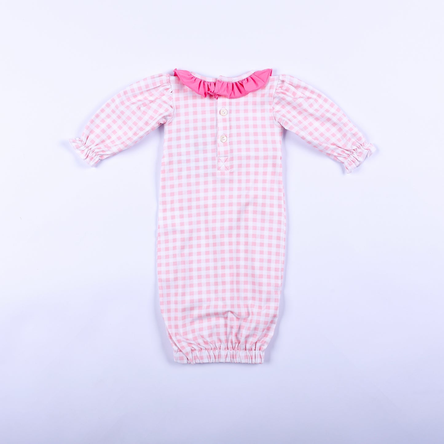 Full back view of pink gingham hand smocked Little Sister layette sleep sack showing button back neck closure.