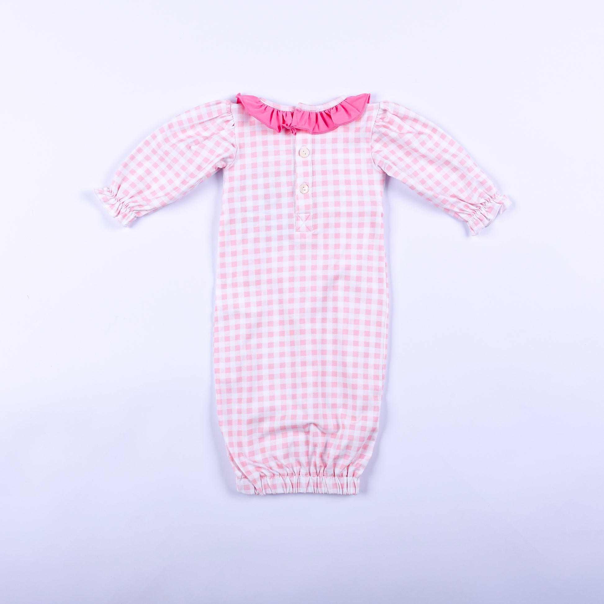 Full back view of pink gingham hand smocked Little Sister layette sleep sack showing button back neck closure.