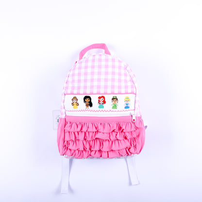 Pink gingham hand-smocked fairytale princess backpack for girls featuring pink ruffles and embroidery.