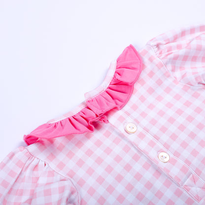 Close-up shot of back button closure and pink ruffle collar on Little Sister hand smocked gingham sleep sack.