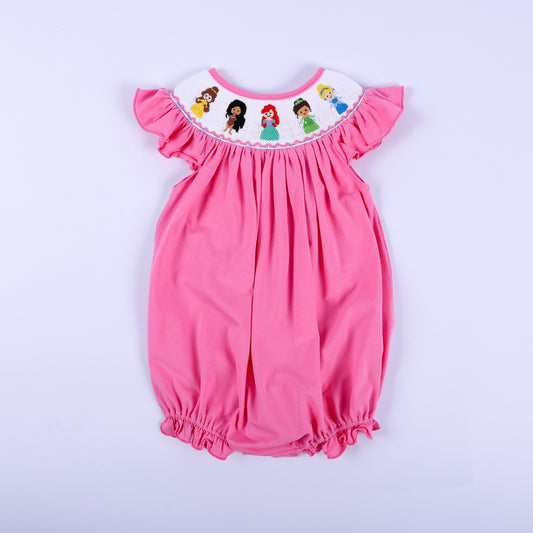 Full view of a pink knit bubble outfit for baby girls featuring hand-smocked embroidered princesses around the neck.
