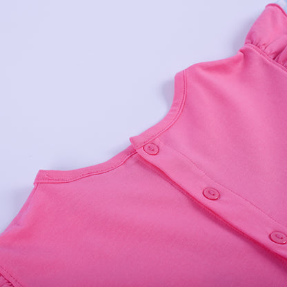 Full back view of girls pink princess knit hand smocked dress showing button closure and blue gingham ruffle hem.
