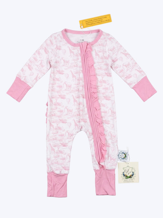 Pink safari-print baby footless sleeper with ruffle zipper trim flat lay on neutral studio backdrop.