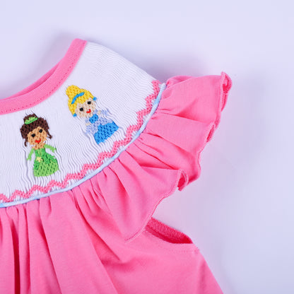 Detailed view of flutter ruffle sleeve and hand-embroidered princess collar on pink smocked baby top.