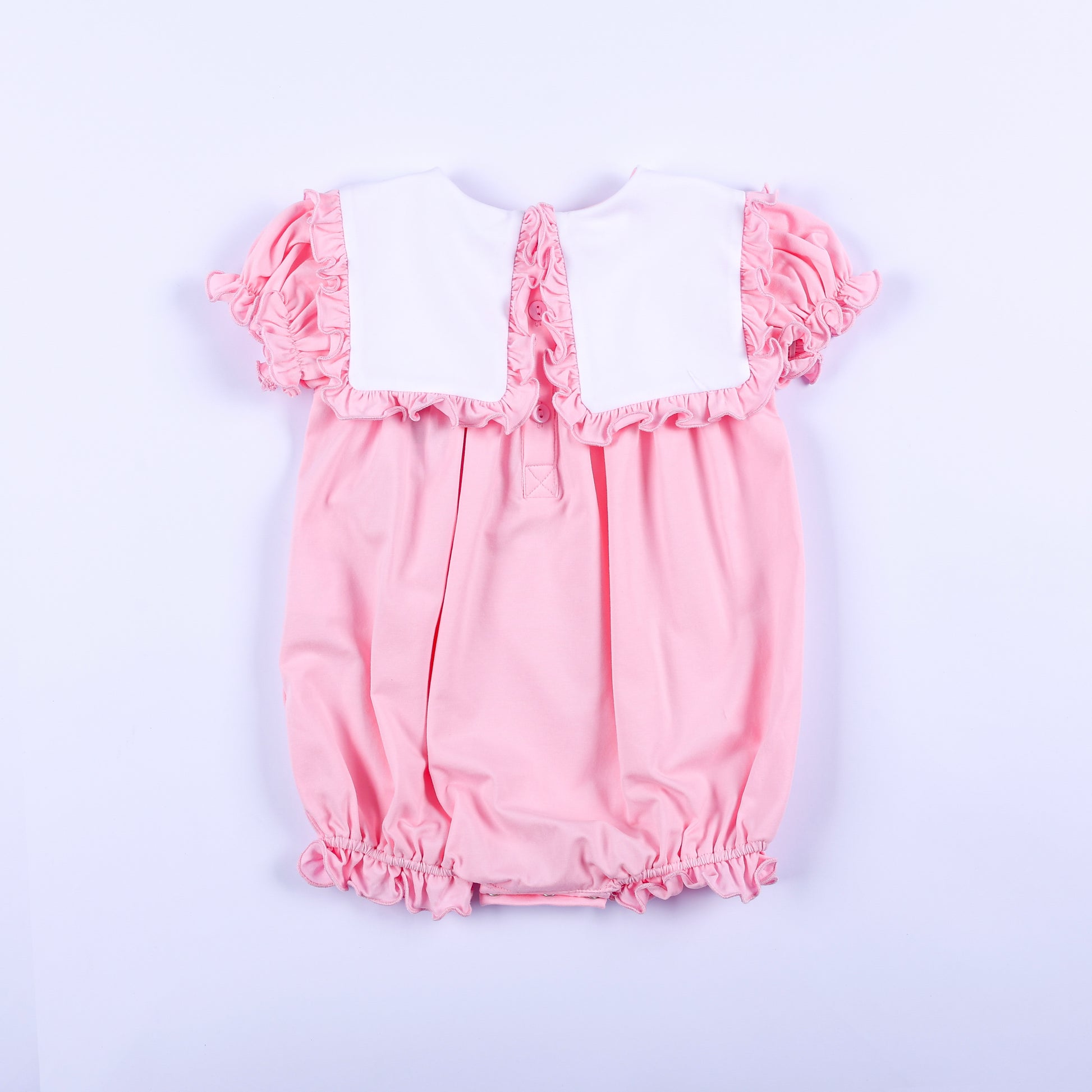 Back view of pink baby girl embroidered bubble romper featuring a white square bib collar with ruffles.