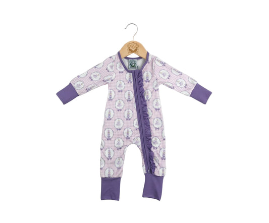 Purple Nutcracker ballet ruffle girls zippy pajama with front zipper detail displayed on wooden baby hanger.