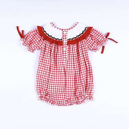 Full back view of red gingham hand-smocked bubble romper showing back button closure placket and ruffled collar.