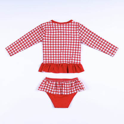 Back view of girls two-piece red gingham long sleeve rash guard swimsuit set with ruffle waist and bottom details.