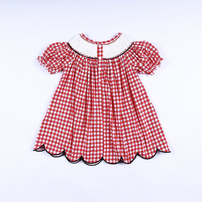 Full back view of the red gingham hand smocked mouse dress showing the button closure and scalloped hem.