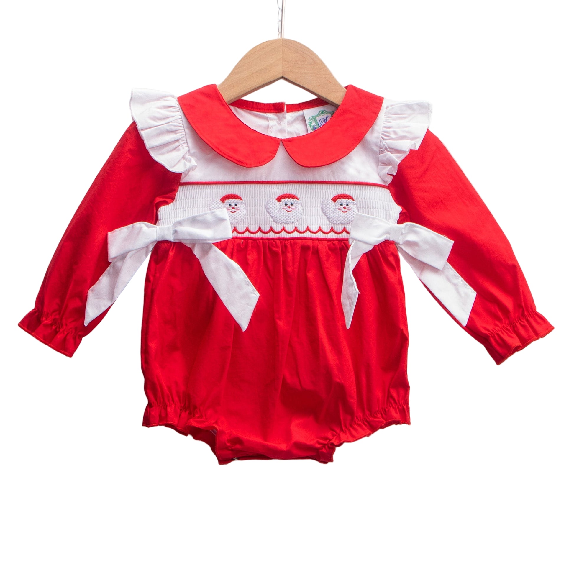 Baby girl red smocked Santa bubble romper with white ruffles and side bows, perfect for Christmas outfits.