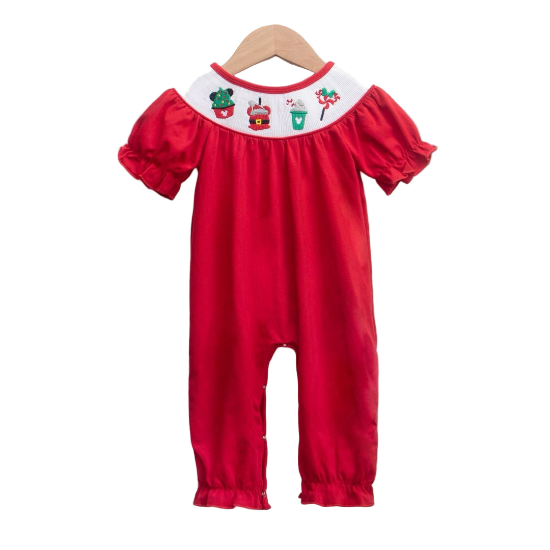 Smocked baby girls red Christmas pants romper with embroidered magical character holiday treats on the white collar.