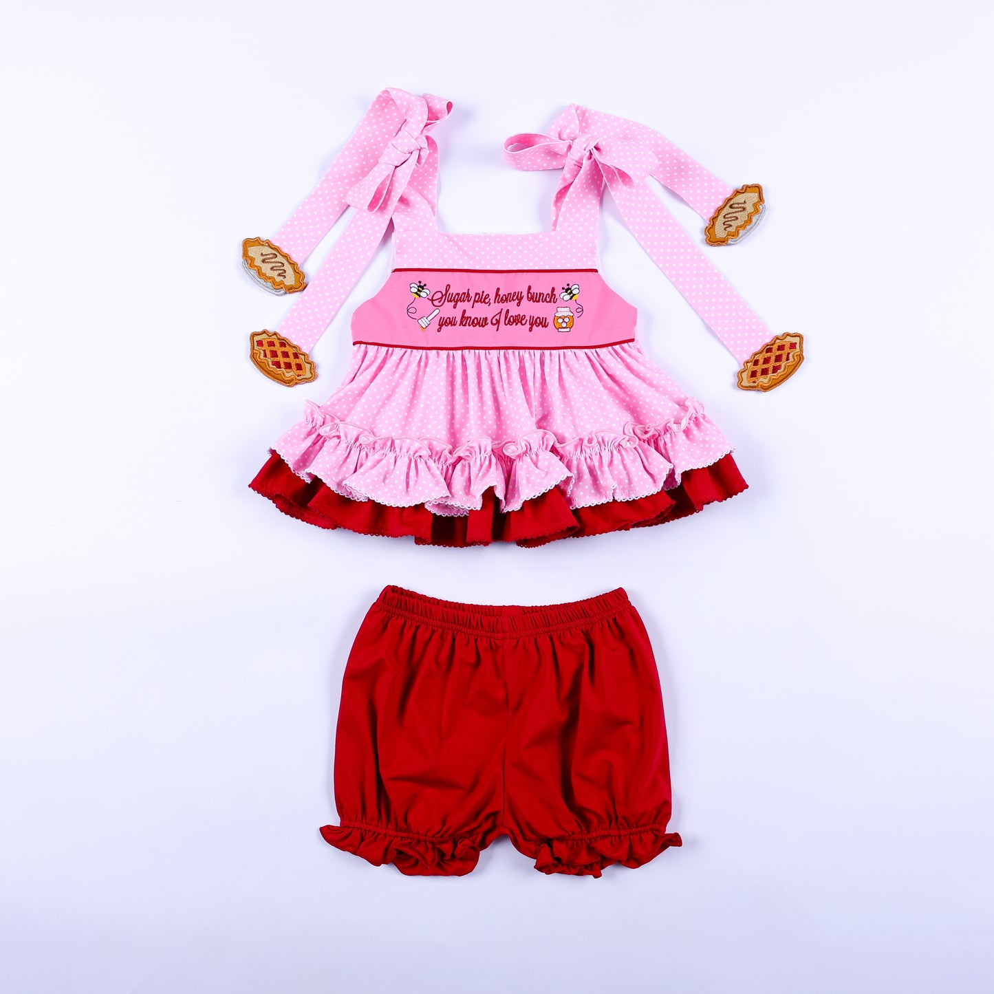 Pink polka dot top and red bloomers set featuring Sugar Pie Honey Bunch embroidery for toddler girls.