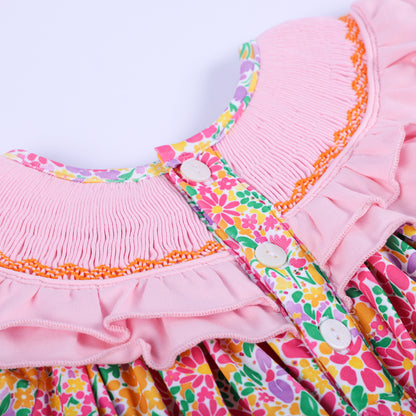 Back view detail of the pink floral Thanksgiving bubble romper, showing the button closures and smocked ruffled collar.