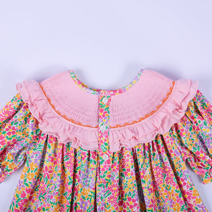 Close-up back view of the pink smocked collar and button closure on the girls boutique Thanksgiving floral tunic.