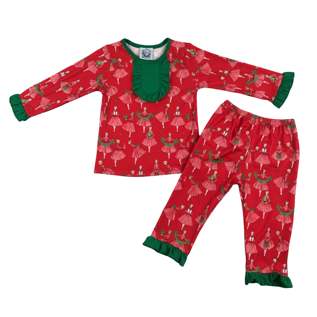Flat lay of Vintage Christmas Lady Icons red holiday pajama set for girls with green ruffle cuffs and neck.